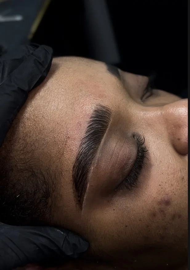 Precision brow artistry result by NORESTHETICS — defined arched brows shaped and groomed during a private appointment